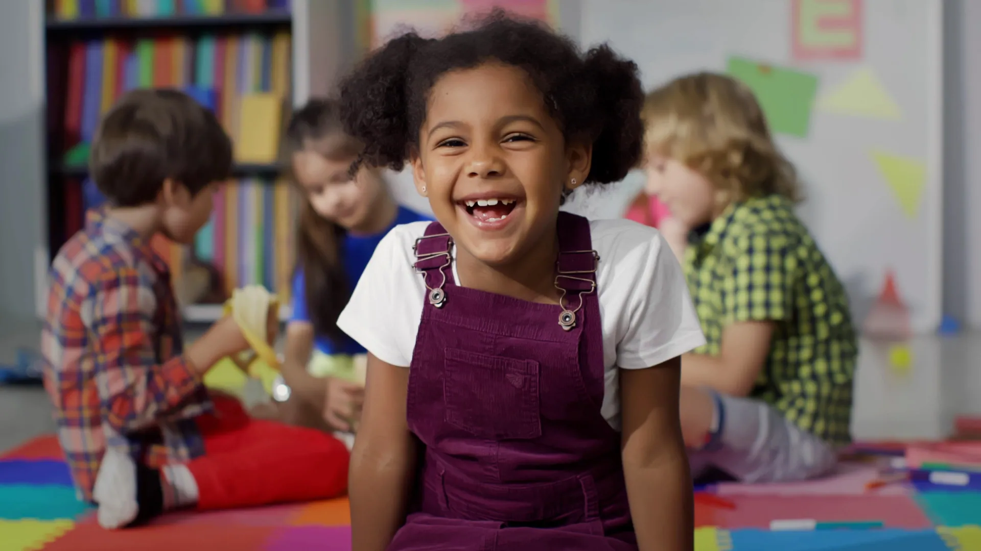 Children painting and creating artwork in a classroom activity